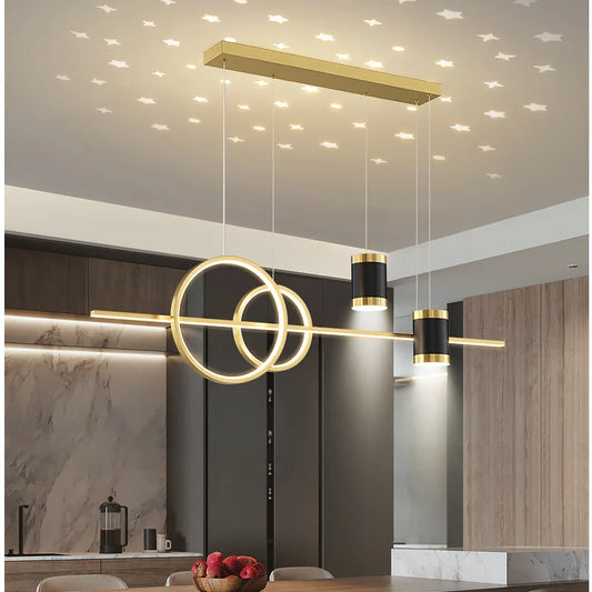 This image features a luxurious chandelier suspended above a kitchen island, radiating a golden glow that enhances the entire room. The golden texture adds a touch of opulence, creating an elegant ambiance. The same product is showcased in multiple color options, emphasizing its versatility to complement any kitchen decor. Experience the perfect blend of sophistication and simplicity in this stunning kitchen lighting solution.