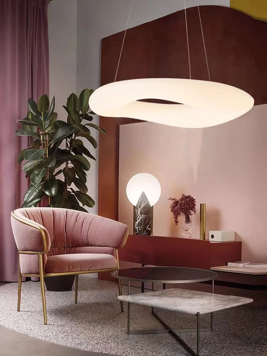 This image features a chandelier designed for a cozy reading retreat, emitting a soft glow that creates a serene atmosphere. The warm lighting enhances the intimate setting, making it an ideal addition to any reading or relaxation space. The product is elegantly showcased to highlight its ability to provide a tranquil and inviting ambiance for moments of quiet reflection and leisure.